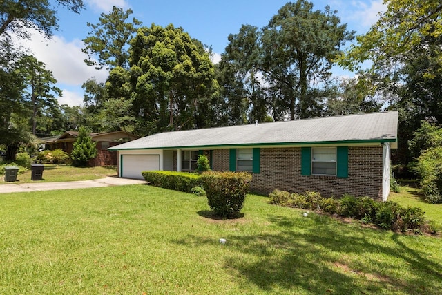 single story home featuring a garage and a front yard