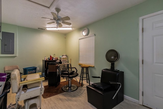 405 Mercury Dr, Tallahassee, FL 32305 - sitting room with electric panel, wood finished floors, a ceiling fan, and a textured ceiling