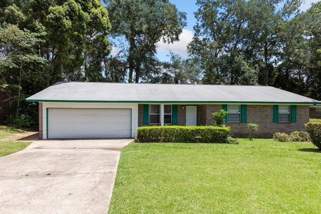 ranch-style home with a garage and a front lawn