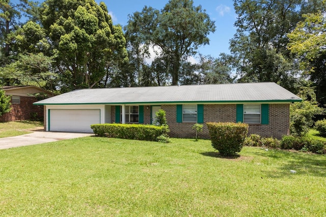 ranch-style home featuring a garage and a front lawn