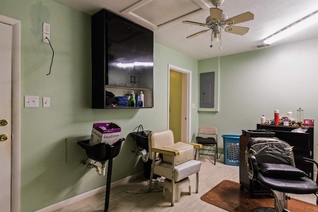 405 Mercury Dr, Tallahassee, FL 32305 - office area featuring electric panel, wood finished floors, a ceiling fan, and attic access