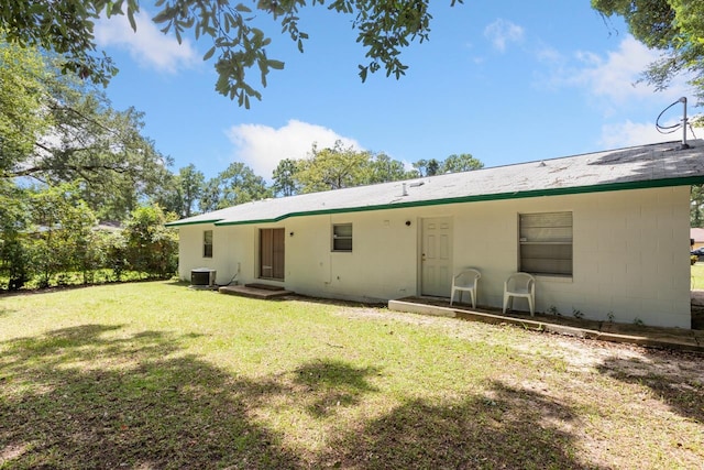 405 Mercury Dr, Tallahassee, FL 32305 - back of house with a lawn and concrete block siding
