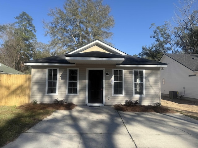 view of front of property with central air condition unit and a patio