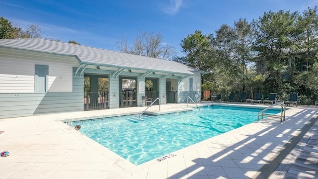 view of swimming pool with a patio area