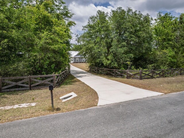 surrounding community with a fenced front yard