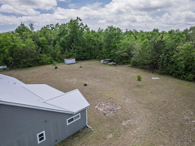 bird's eye view featuring a view of trees
