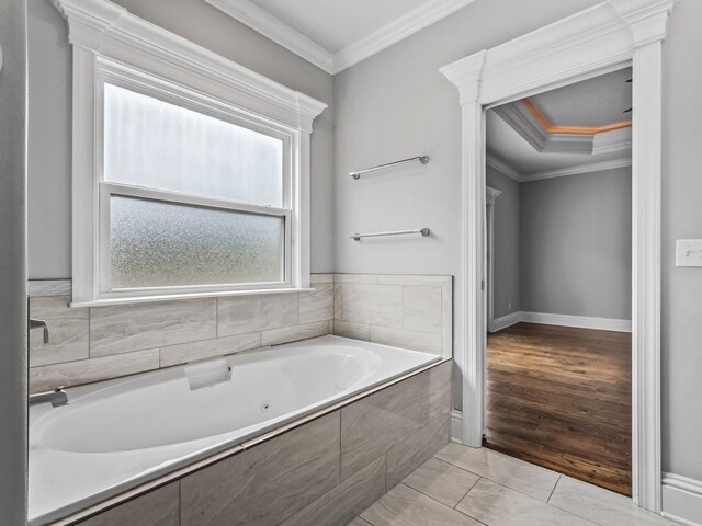 full bathroom with a tub with jets and crown molding