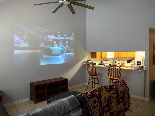 tiled living room with ceiling fan