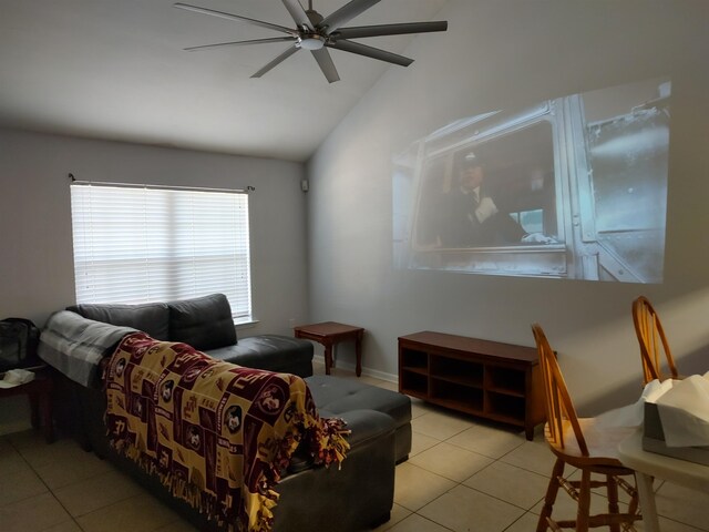 living room with ceiling fan, light tile patterned floors, and lofted ceiling