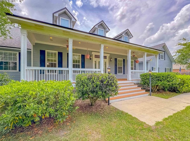 view of front of property with a ceiling fan and a porch