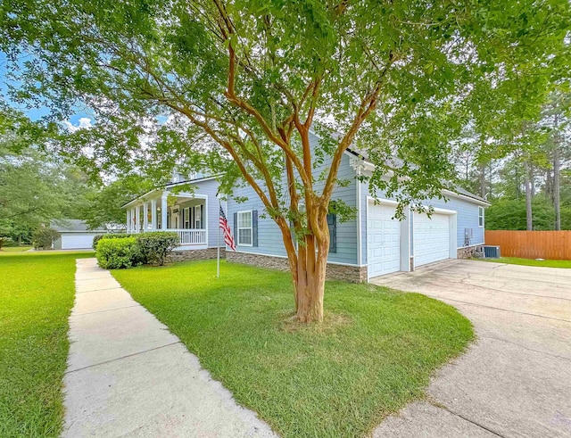 view of front of property featuring fence, a front lawn, a porch, central AC unit, and driveway