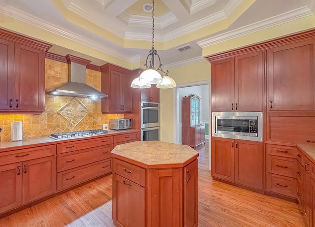 kitchen featuring visible vents, appliances with stainless steel finishes, ornamental molding, and wall chimney exhaust hood
