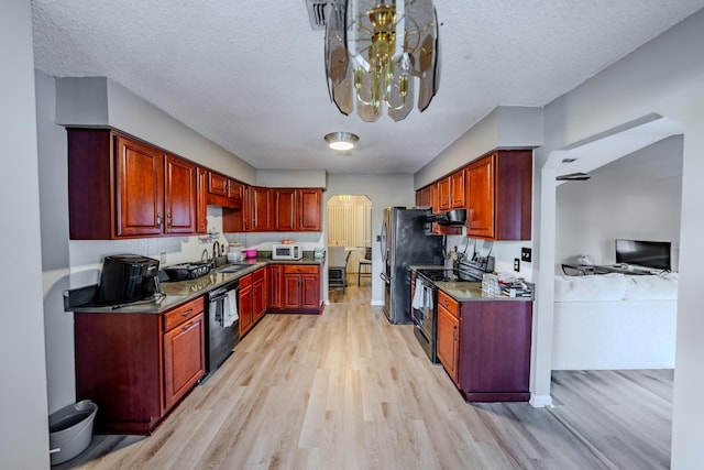 kitchen with sink, a textured ceiling, black appliances, and light hardwood / wood-style flooring