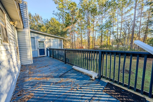 deck featuring a water view and a yard