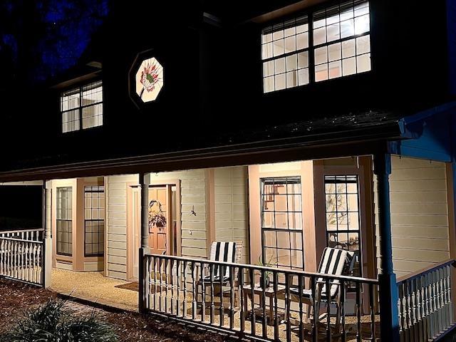 exterior entry at twilight with a porch