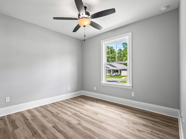 spare room with ceiling fan and light hardwood / wood-style floors