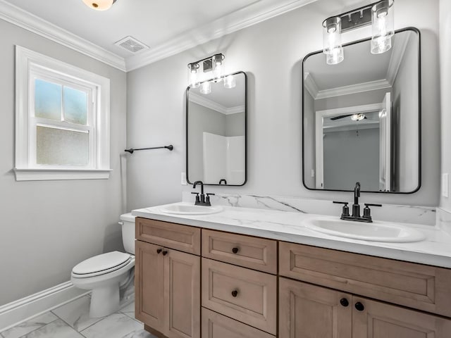 bathroom with vanity, toilet, and crown molding