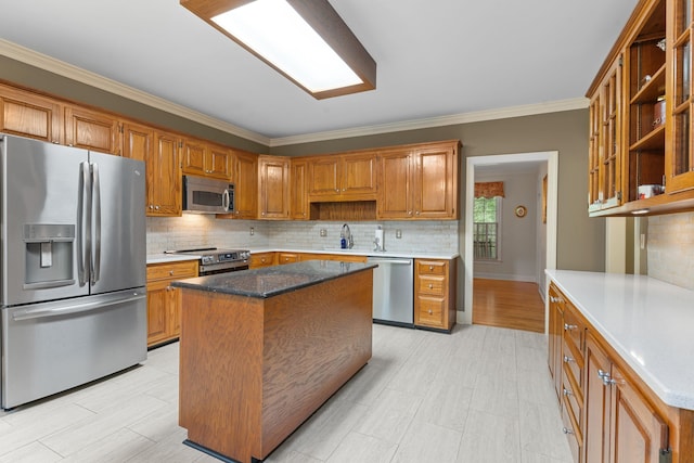 1961 Chatsworth Way, Tallahassee, FL 32309 - kitchen featuring appliances with stainless steel finishes, ornamental molding, tasteful backsplash, brown cabinetry, and open shelves