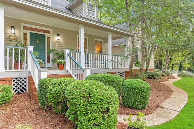 1961 Chatsworth Way, Tallahassee, FL 32309 - doorway to property featuring a porch and roof with shingles