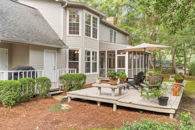 1961 Chatsworth Way, Tallahassee, FL 32309 - rear view of property with a sunroom, a chimney, a wooden deck, and a shingled roof