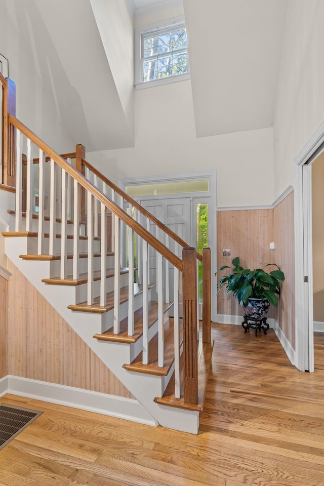 1961 Chatsworth Way, Tallahassee, FL 32309 - stairway with wood finished floors, wood walls, and a high ceiling