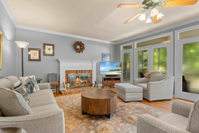 1961 Chatsworth Way, Tallahassee, FL 32309 - living room featuring ornamental molding, wood finished floors, ceiling fan, and a fireplace