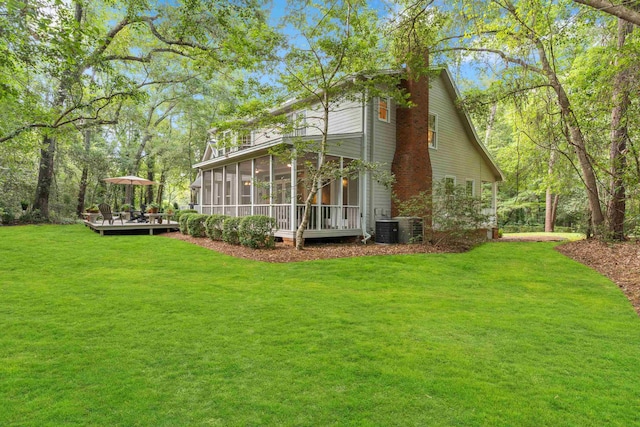 1961 Chatsworth Way, Tallahassee, FL 32309 - rear view of house with a sunroom, a yard, and a deck
