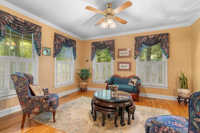 1961 Chatsworth Way, Tallahassee, FL 32309 - living area with plenty of natural light, wood finished floors, ornamental molding, and a ceiling fan