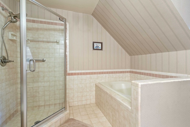 1961 Chatsworth Way, Tallahassee, FL 32309 - full bath featuring wallpapered walls, a garden tub, a shower stall, vaulted ceiling, and tile patterned flooring