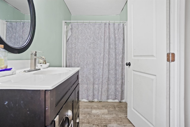 bathroom with vanity and wood finished floors