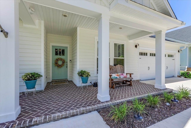 3837 Broadmore Ln, Tallahassee, FL 32308 - doorway to property with covered porch, driveway, and a garage