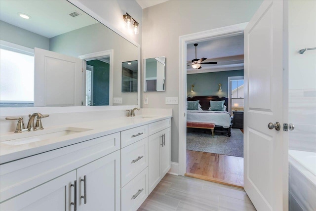 3837 Broadmore Ln, Tallahassee, FL 32308 - ensuite bathroom featuring ceiling fan and double vanity