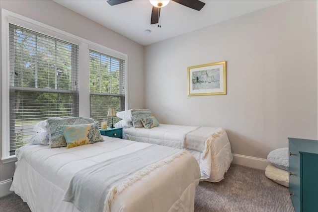 3837 Broadmore Ln, Tallahassee, FL 32308 - carpeted bedroom with baseboards and a ceiling fan