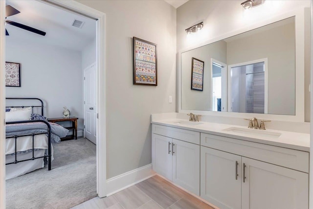3837 Broadmore Ln, Tallahassee, FL 32308 - ensuite bathroom with ceiling fan, double vanity, and baseboards