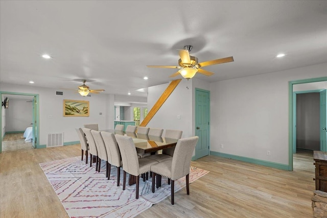 dining space with light hardwood / wood-style flooring and ceiling fan