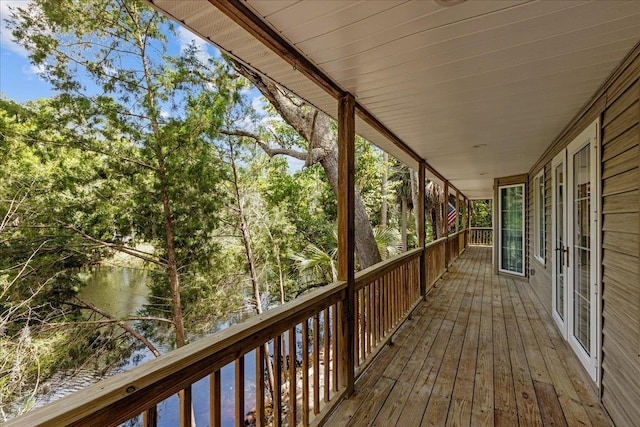 wooden terrace with a water view