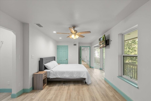 bedroom featuring ceiling fan and light wood-type flooring