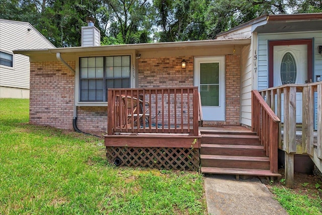 1515 Merry Oaks Ct, Tallahassee, FL 32303 - doorway to property featuring brick siding, a chimney, and a yard