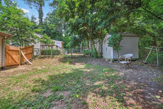1515 Merry Oaks Ct, Tallahassee, FL 32303 - fenced backyard featuring a storage unit and view of wooded area