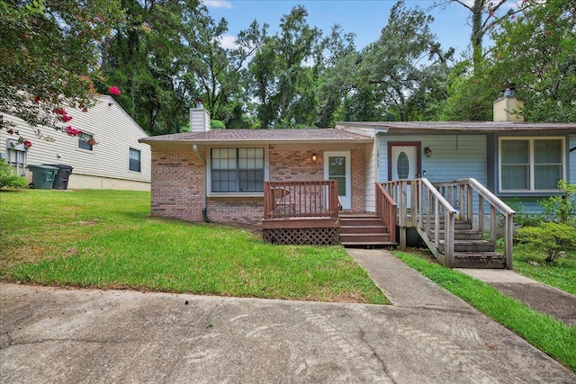 1515 Merry Oaks Ct, Tallahassee, FL 32303 - view of front of house featuring a chimney, brick siding, and a front yard