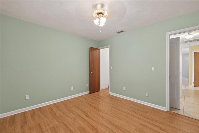 1515 Merry Oaks Ct, Tallahassee, FL 32303 - unfurnished bedroom featuring light wood-type flooring and a ceiling fan
