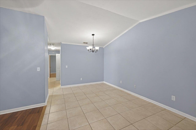 1515 Merry Oaks Ct, Tallahassee, FL 32303 - spare room with a chandelier, ornamental molding, lofted ceiling, and light tile patterned floors
