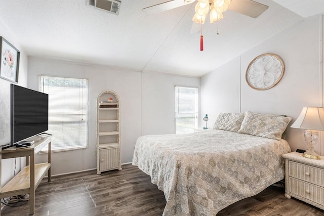 bedroom featuring dark wood-style floors and ceiling fan