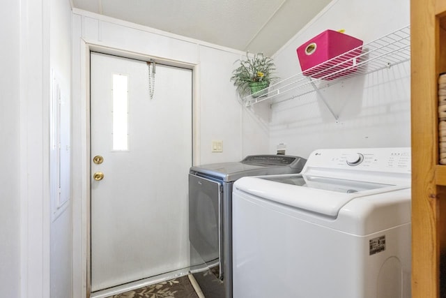 laundry area with separate washer and dryer