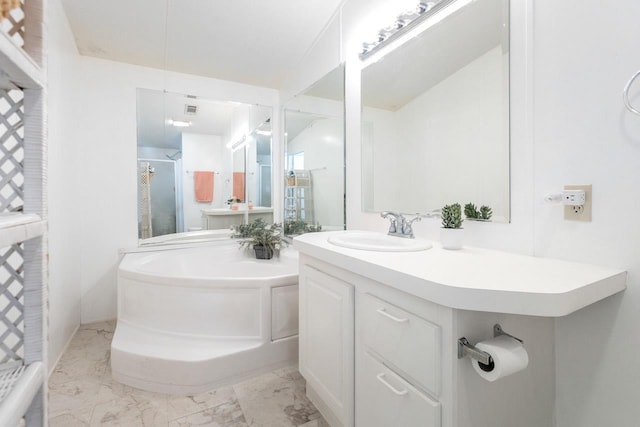 full bathroom featuring a garden tub, marble finish floors, vanity, and a shower stall
