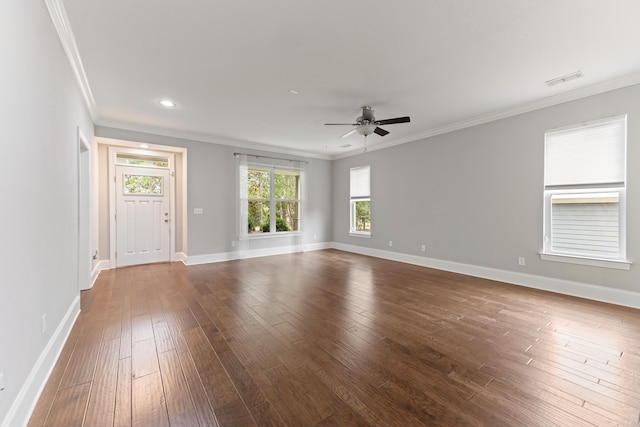 unfurnished living room with baseboards, ornamental molding, dark wood finished floors, and a ceiling fan