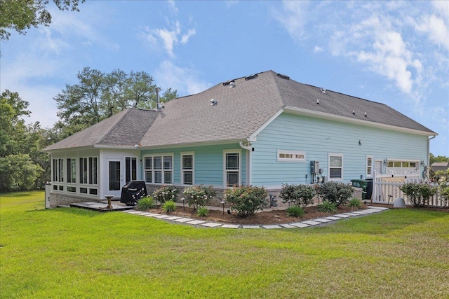 7277 White Clover Ct, Tallahassee, FL 32311 - rear view of property with a yard, a sunroom, and roof with shingles