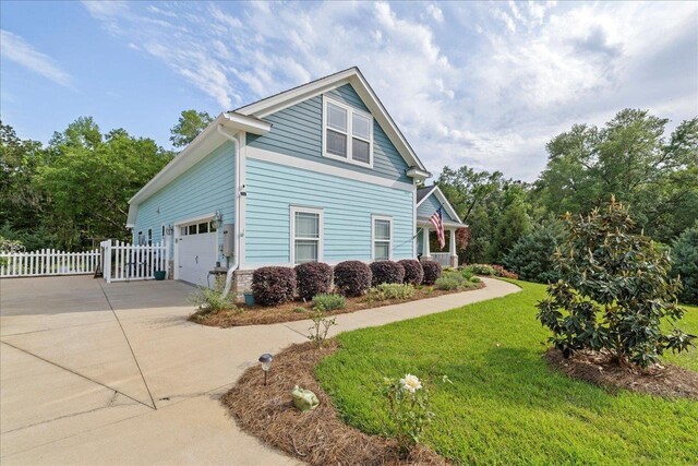 7277 White Clover Ct, Tallahassee, FL 32311 - view of side of home featuring driveway and an attached garage