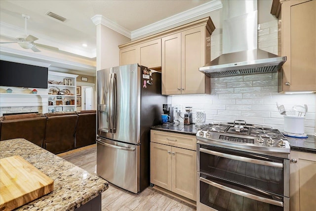 7277 White Clover Ct, Tallahassee, FL 32311 - kitchen featuring stainless steel appliances, wall chimney exhaust hood, ornamental molding, ceiling fan, and tasteful backsplash