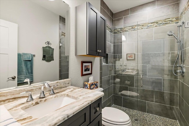 7277 White Clover Ct, Tallahassee, FL 32311 - bathroom with a shower stall, vanity, and toilet